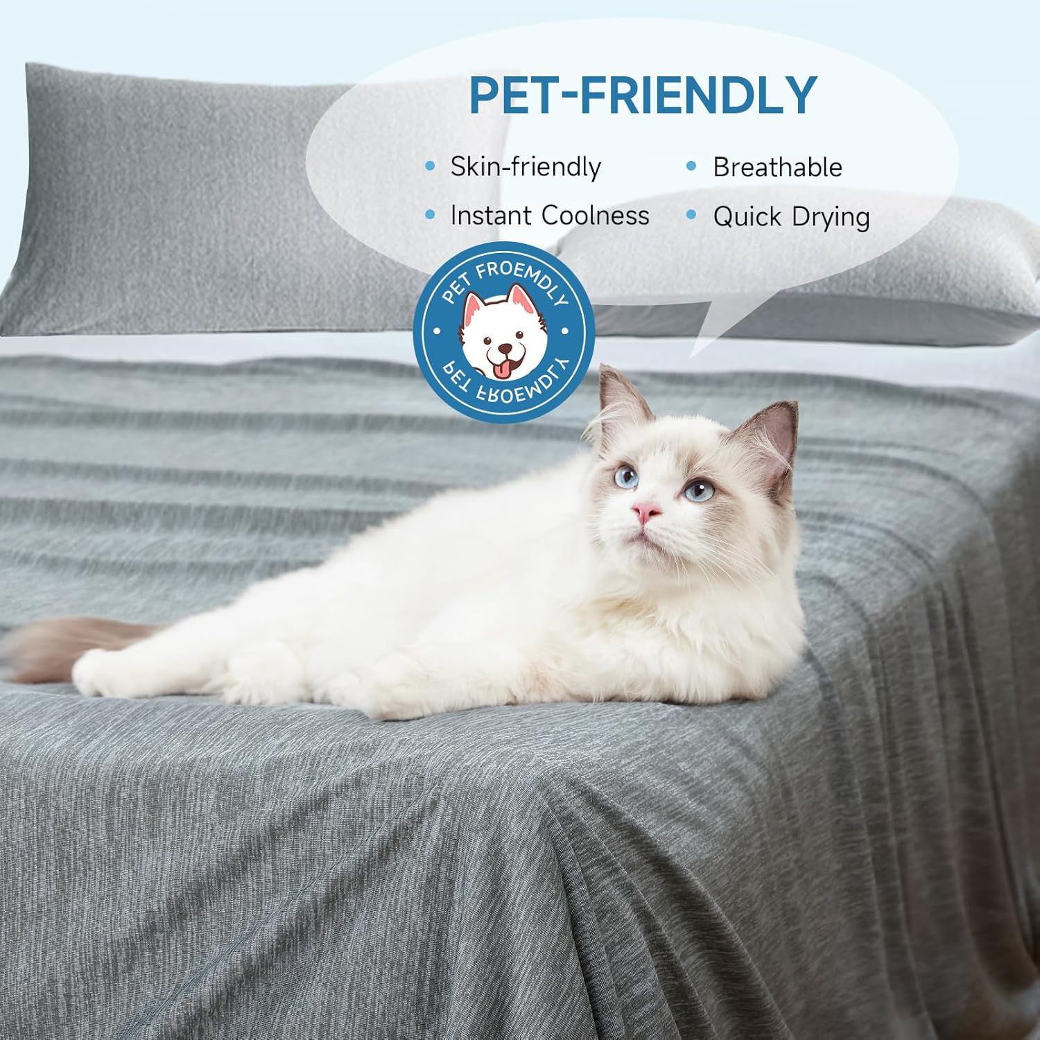 The grey cooling blanket used as a bed cover with a cat lying on it, showing the smooth knitted surface